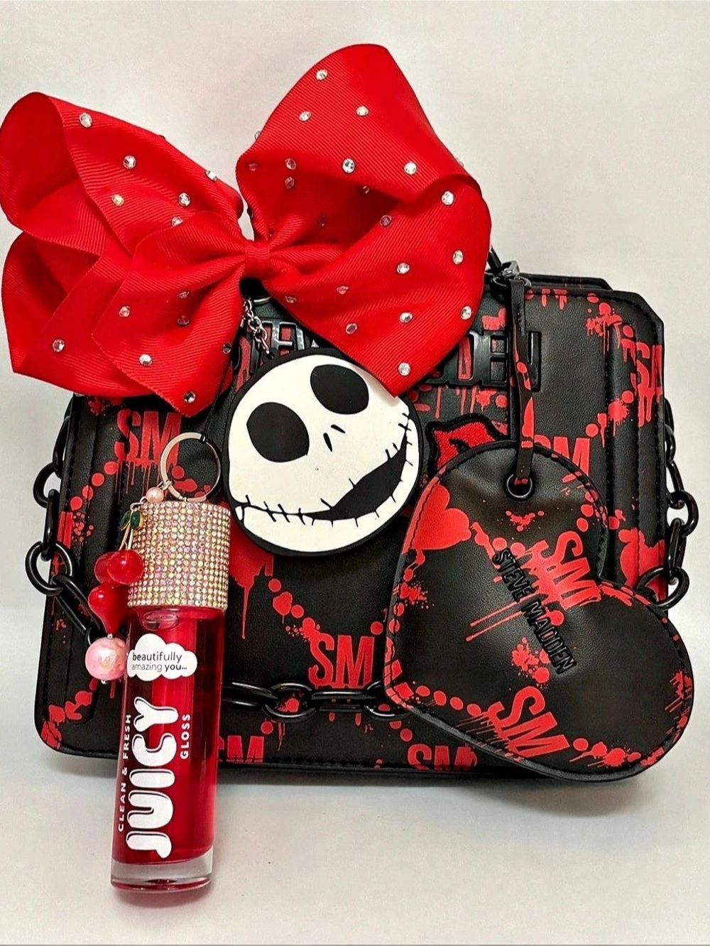 Steve Madden purse decorated with Jack Skellington chapstick holder and gloss!!
